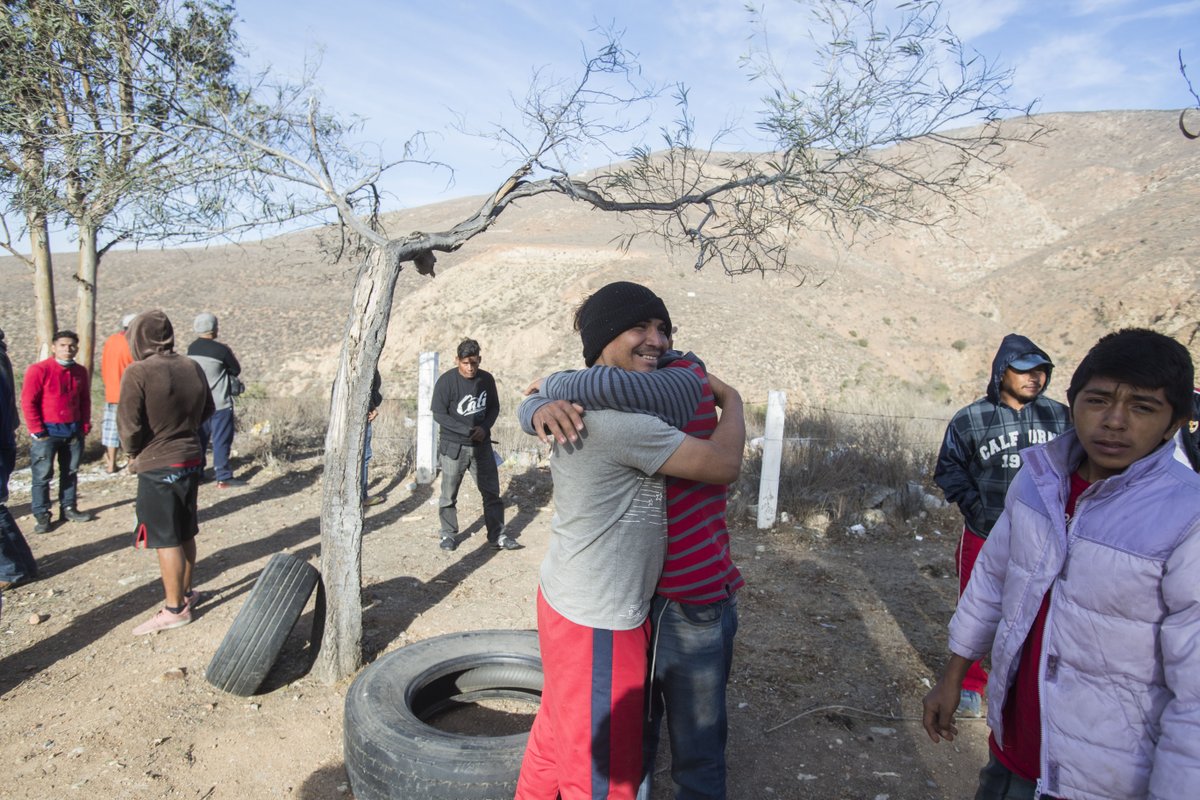 Photos: Members of the migrant caravan arrive on the outskirts of Tijuana, Mexico on Tuesday. The group of 350 migrants traveled in 9 buses on the last part of the trip from Hermosillo, Sonora.    